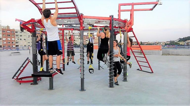 Fitness enthusiasts using IVE CLOCK outdoor stations at Sky Fitness in Budapest, Hungary
